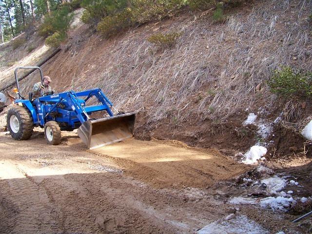 Curtis is getting the ground nice and level for the coop.
