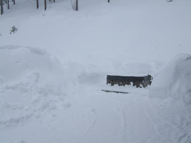 The deck area has so much snow, it avalanches back onto the deck. Soon  there will be no more space to put the snow.