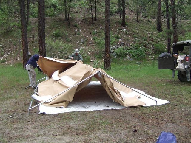 The tent goes down faster than it goes up. Since it is wet, it is not rolled up and put in its' bag.