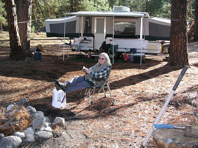 Jane relaaxing in the cool October weather after the camp setup is complete.