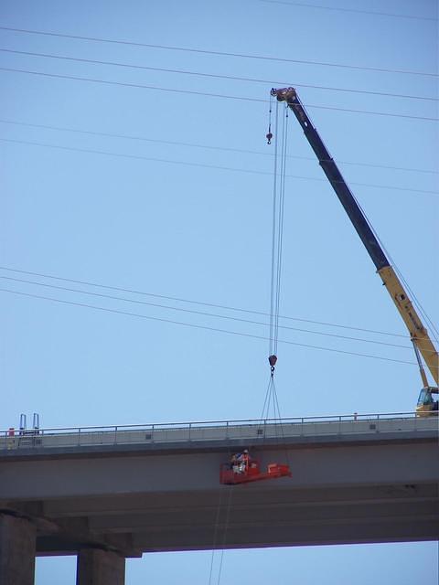 Take a good look at the two men working on the bridge. Wouldn't you love to work there.