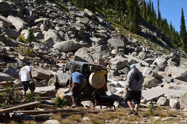 Some people try rock crawling while waiting for people to catch up with the group.