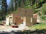 Waiting for the trusses to come for the second floor. Siding is on too.