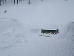 The deck area has so much snow, it avalanches back onto the deck. Soon  there will be no more space to put the snow.
