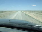 The road detriorated to a one lane road, but there was no traffic. The road was still in good shape.