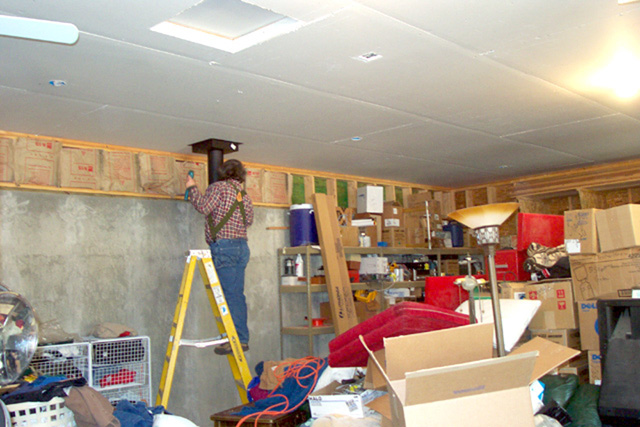 Curtis putting in the garage stove where we are living till November