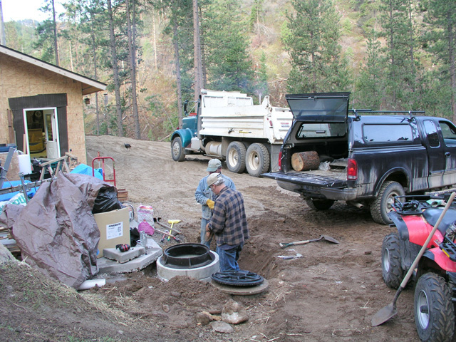 putting in a man hole before paving       
